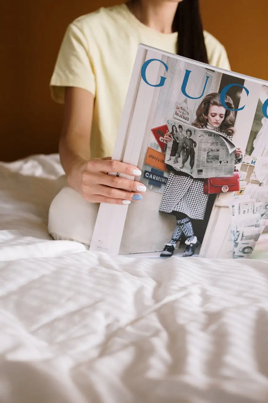 woman in white t shirt holding white and red book